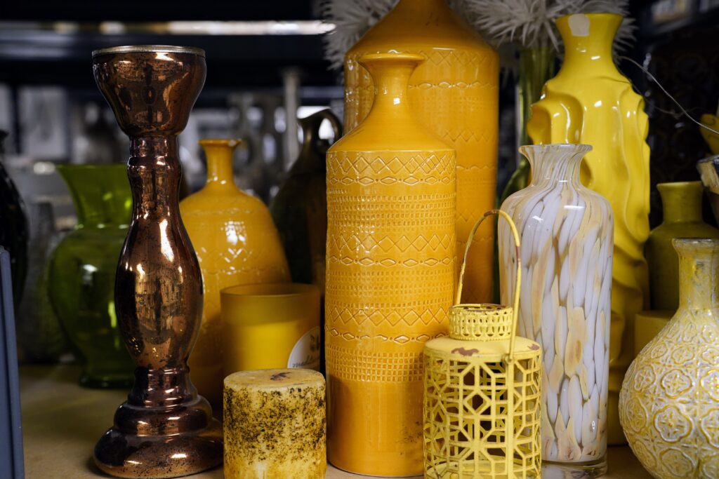 Staging inventory, vases that are yellow different sizes. 